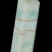 Pistachio Calcite obelisk 131*37*30mm 324g in sunlight - Rocks and Things Store