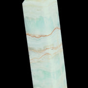 Pistachio Calcite obelisk 131*37*30mm 324g in sunlight - Rocks and Things Store