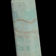 Pistachio Calcite obelisk 131*37*30mm 324g in sunlight - Rocks and Things Store