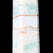 Pistachio Calcite obelisk 131*37*30mm 324g in sunlight - Rocks and Things Store
