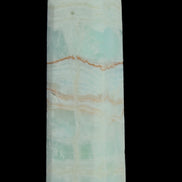 Pistachio Calcite obelisk 131*37*30mm 324g in sunlight - Rocks and Things Store