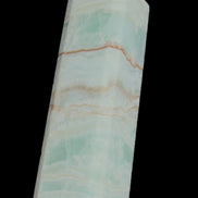 Pistachio Calcite obelisk 131*37*30mm 324g in sunlight - Rocks and Things Store