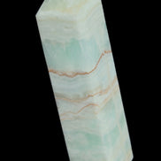 Pistachio Calcite obelisk 131*37*30mm 324g in sunlight - Rocks and Things Store