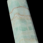 Pistachio Calcite obelisk 131*37*30mm 324g in sunlight - Rocks and Things Store