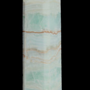 Pistachio Calcite obelisk 131*37*30mm 324g in sunlight - Rocks and Things Store