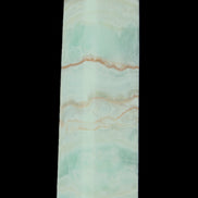 Pistachio Calcite obelisk 131*37*30mm 324g in sunlight - Rocks and Things Store