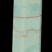 Pistachio Calcite obelisk 131*37*30mm 324g in sunlight - Rocks and Things Store