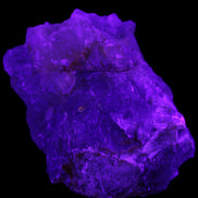 Clear Fluorite cubic stepped cluster 104*72*50mm 660g in UV light - Rocks and Things Store
