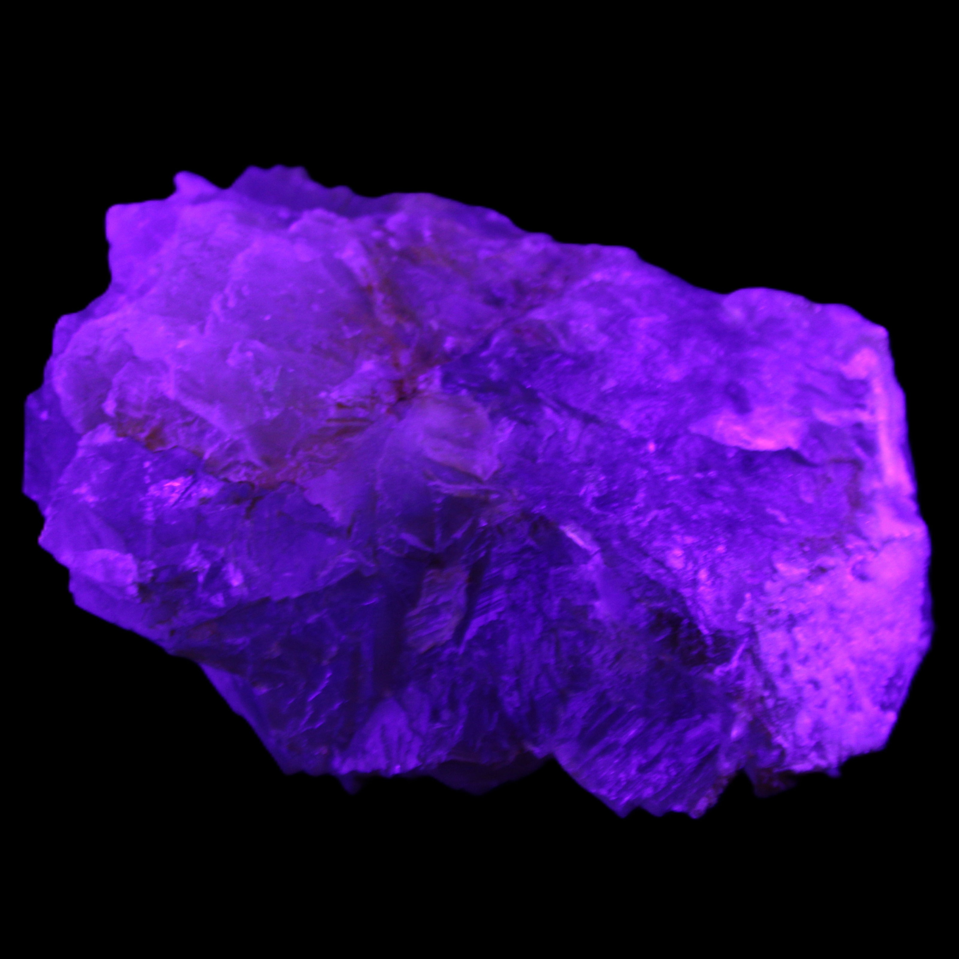 Clear Fluorite cubic stepped cluster 104*72*50mm 660g in UV light - Rocks and Things Store