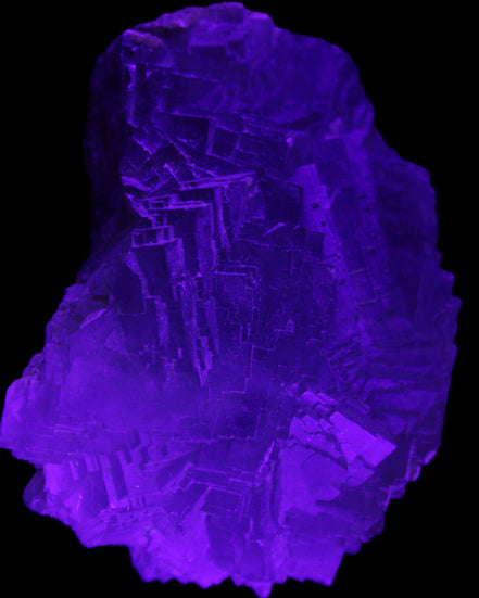 Clear Fluorite cubic stepped cluster 104*72*50mm 660g in UV light - Rocks and Things Store