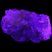 Clear Fluorite cubic stepped cluster 104*72*50mm 660g in UV light - Rocks and Things Store