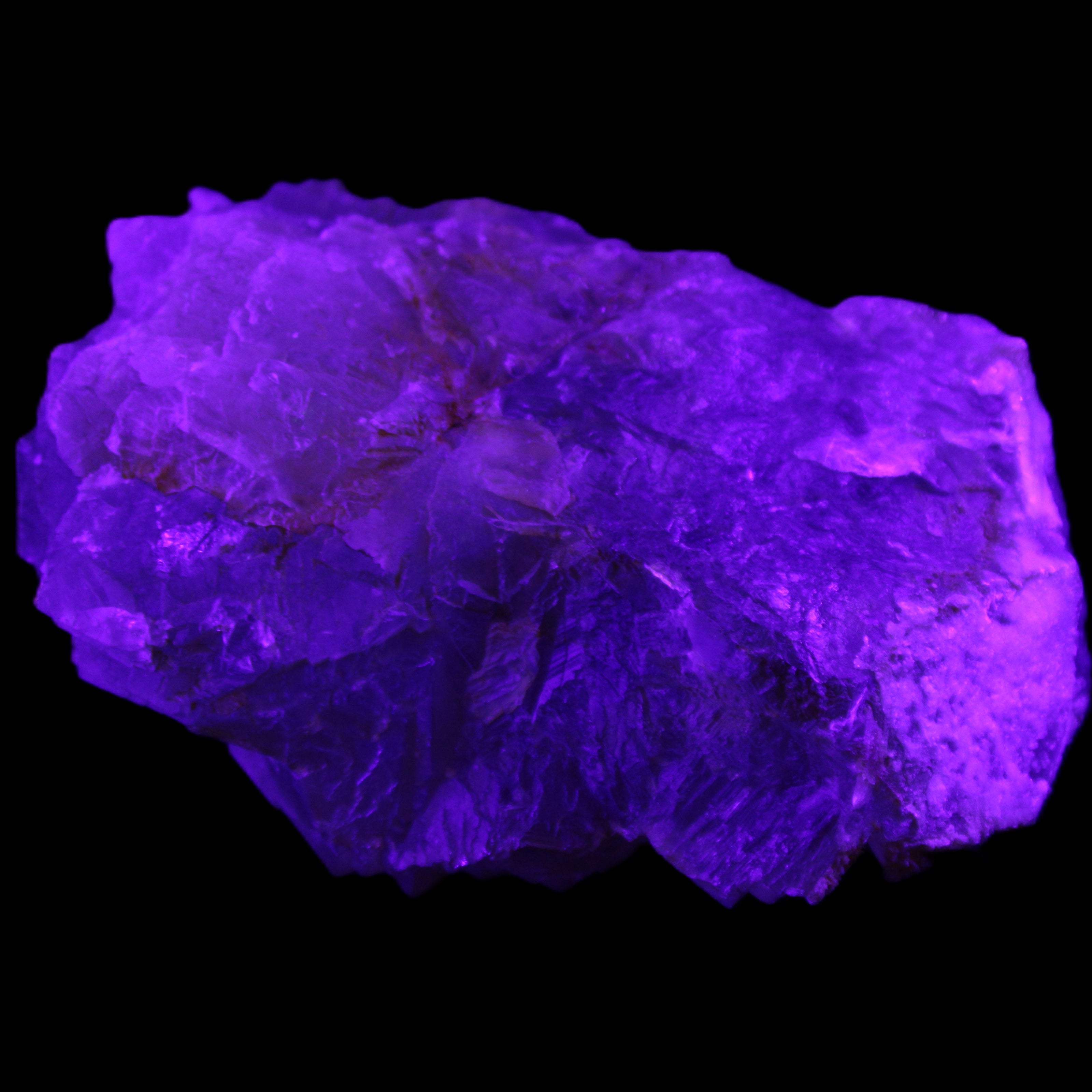 Clear Fluorite cubic stepped cluster 104*72*50mm 660g in UV light - Rocks and Things Store