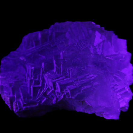 Clear Fluorite cubic stepped cluster 104*72*50mm 660g in UV light - Rocks and Things Store