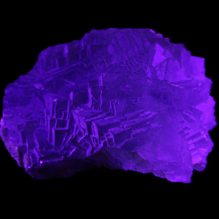 Clear Fluorite cubic stepped cluster 104*72*50mm 660g in UV light - Rocks and Things Store