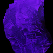 Clear Fluorite cubic stepped cluster 104*72*50mm 660g in UV light - Rocks and Things Store