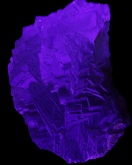 Clear Fluorite cubic stepped cluster 104*72*50mm 660g in UV light - Rocks and Things Store