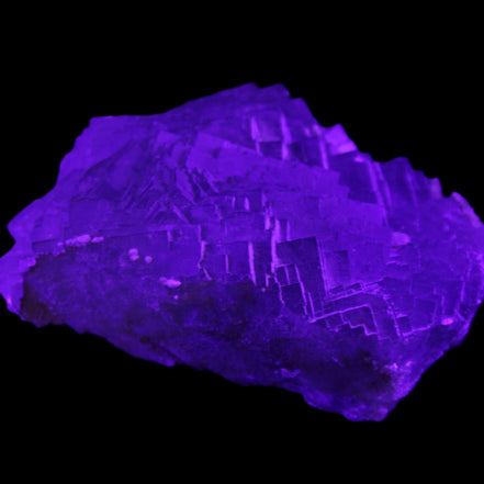 Clear Fluorite cubic stepped cluster 104*72*50mm 660g in UV light - Rocks and Things Store