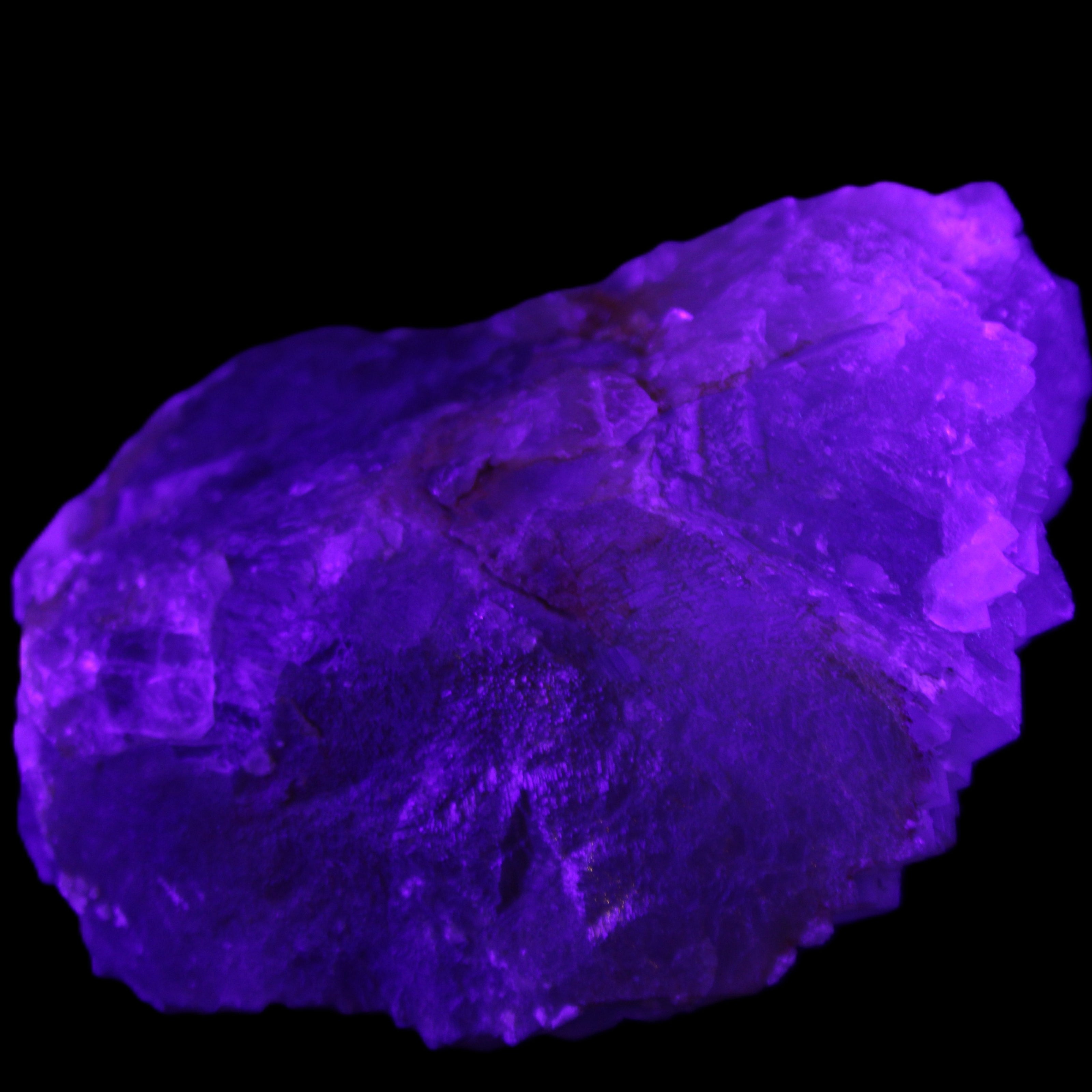 Clear Fluorite cubic stepped cluster 104*72*50mm 660g in UV light - Rocks and Things Store