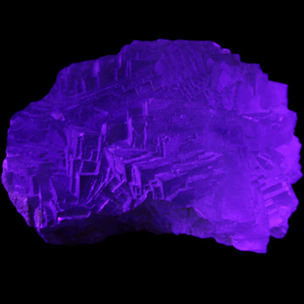 Clear Fluorite cubic stepped cluster 104*72*50mm 660g in UV light - Rocks and Things Store