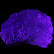 Clear Fluorite cubic stepped cluster 104*72*50mm 660g in UV light - Rocks and Things Store