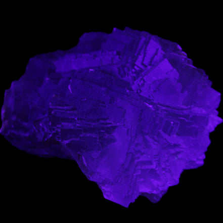 Clear Fluorite cubic stepped cluster 104*72*50mm 660g in UV light - Rocks and Things Store