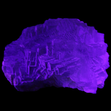 Clear Fluorite cubic stepped cluster 104*72*50mm 660g in UV light - Rocks and Things Store