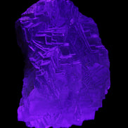 Clear Fluorite cubic stepped cluster 104*72*50mm 660g in UV light - Rocks and Things Store