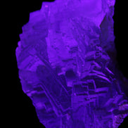 Clear Fluorite cubic stepped cluster 104*72*50mm 660g in UV light - Rocks and Things Store