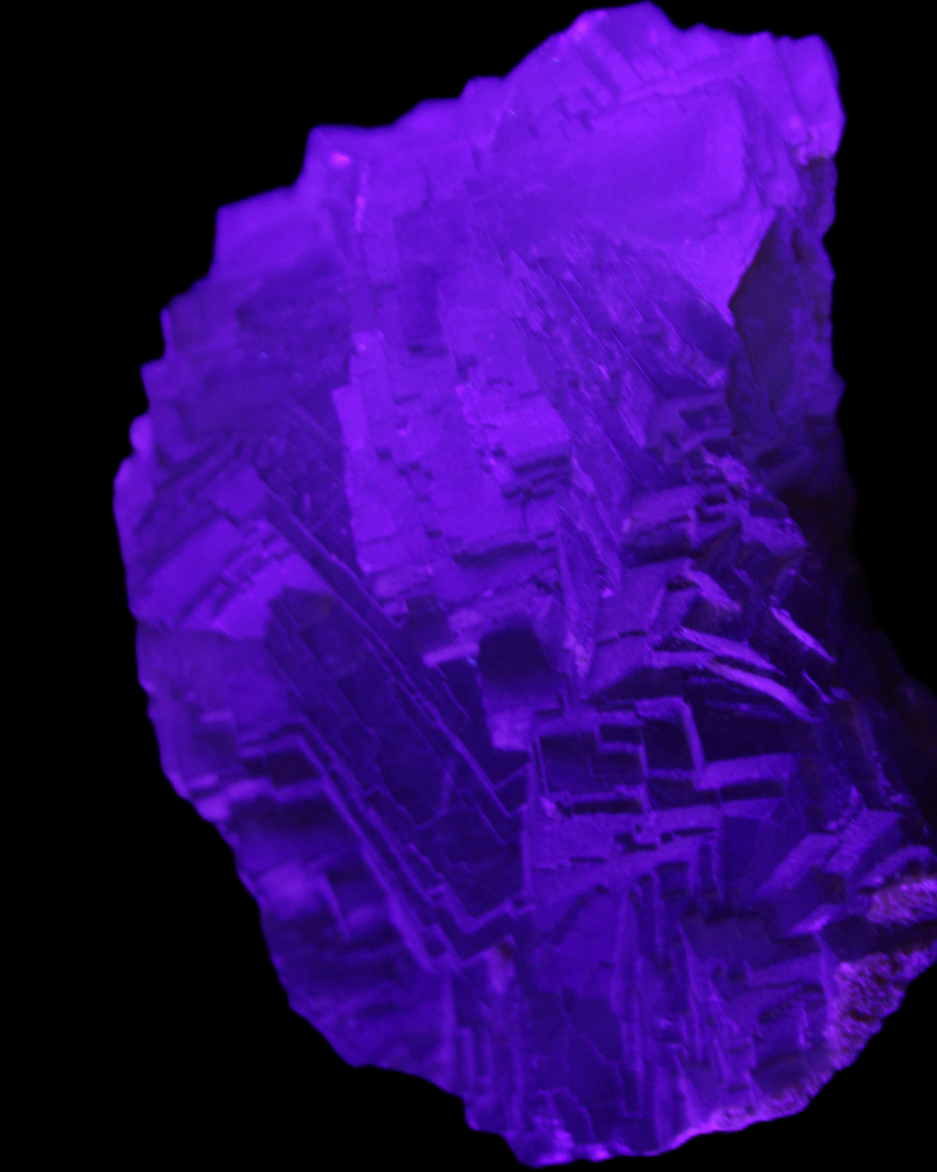 Clear Fluorite cubic stepped cluster 104*72*50mm 660g in UV light - Rocks and Things Store