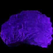 Clear Fluorite cubic stepped cluster 104*72*50mm 660g in UV light - Rocks and Things Store