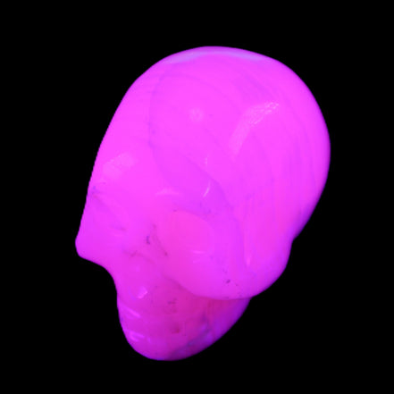 Mangano Calcite skull 31*47*40mm 87g in UV light - Rocks and Things Store