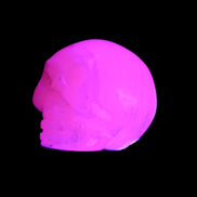 Mangano Calcite skull 31*47*40mm 87g in UV light - Rocks and Things Store