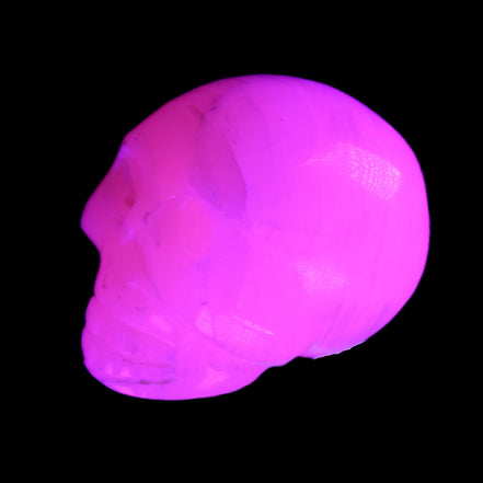 Mangano Calcite skull 31*47*40mm 87g in UV light - Rocks and Things Store
