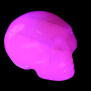 Mangano Calcite skull 31*47*40mm 87g in UV light - Rocks and Things Store