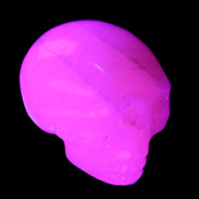 Mangano Calcite skull 31*47*40mm 87g in UV light - Rocks and Things Store