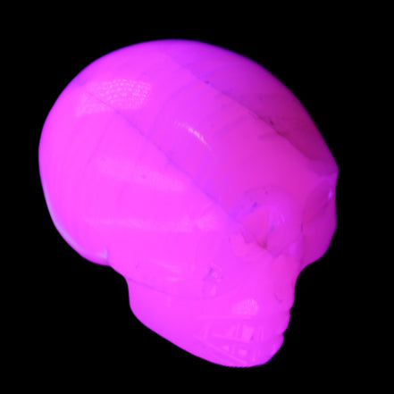 Mangano Calcite skull 31*47*40mm 87g in UV light - Rocks and Things Store