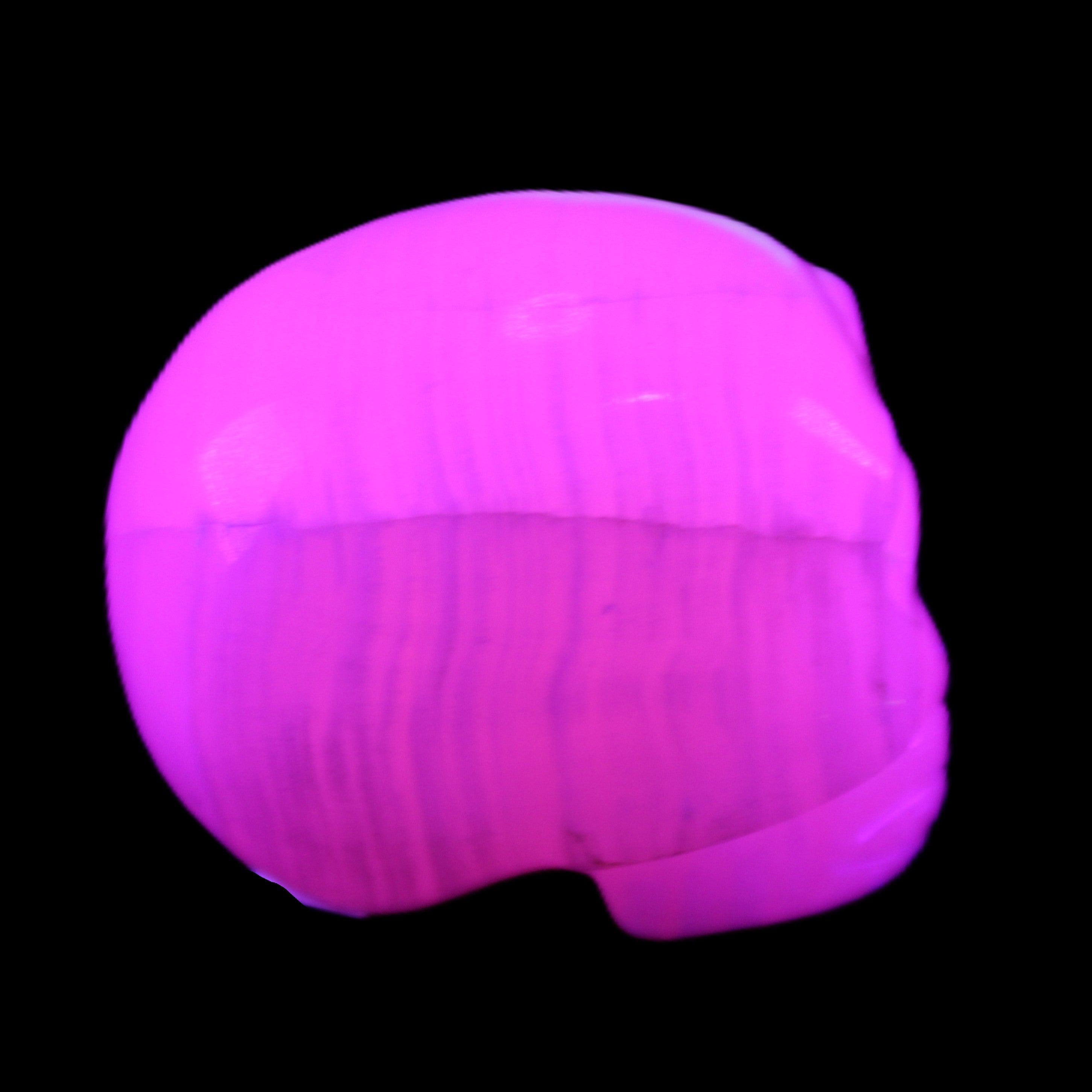Mangano Calcite skull 31*47*40mm 87g in UV light - Rocks and Things Store