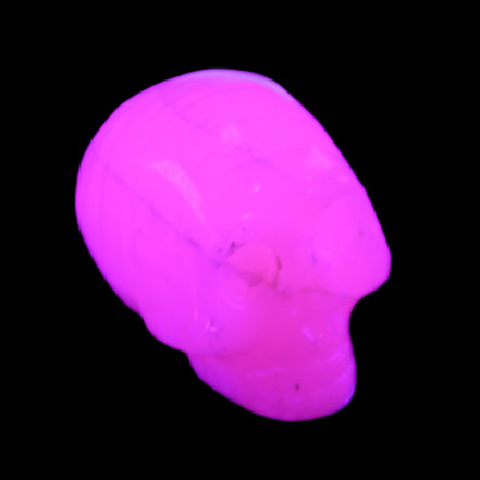 Mangano Calcite skull 31*47*40mm 87g in UV light - Rocks and Things Store