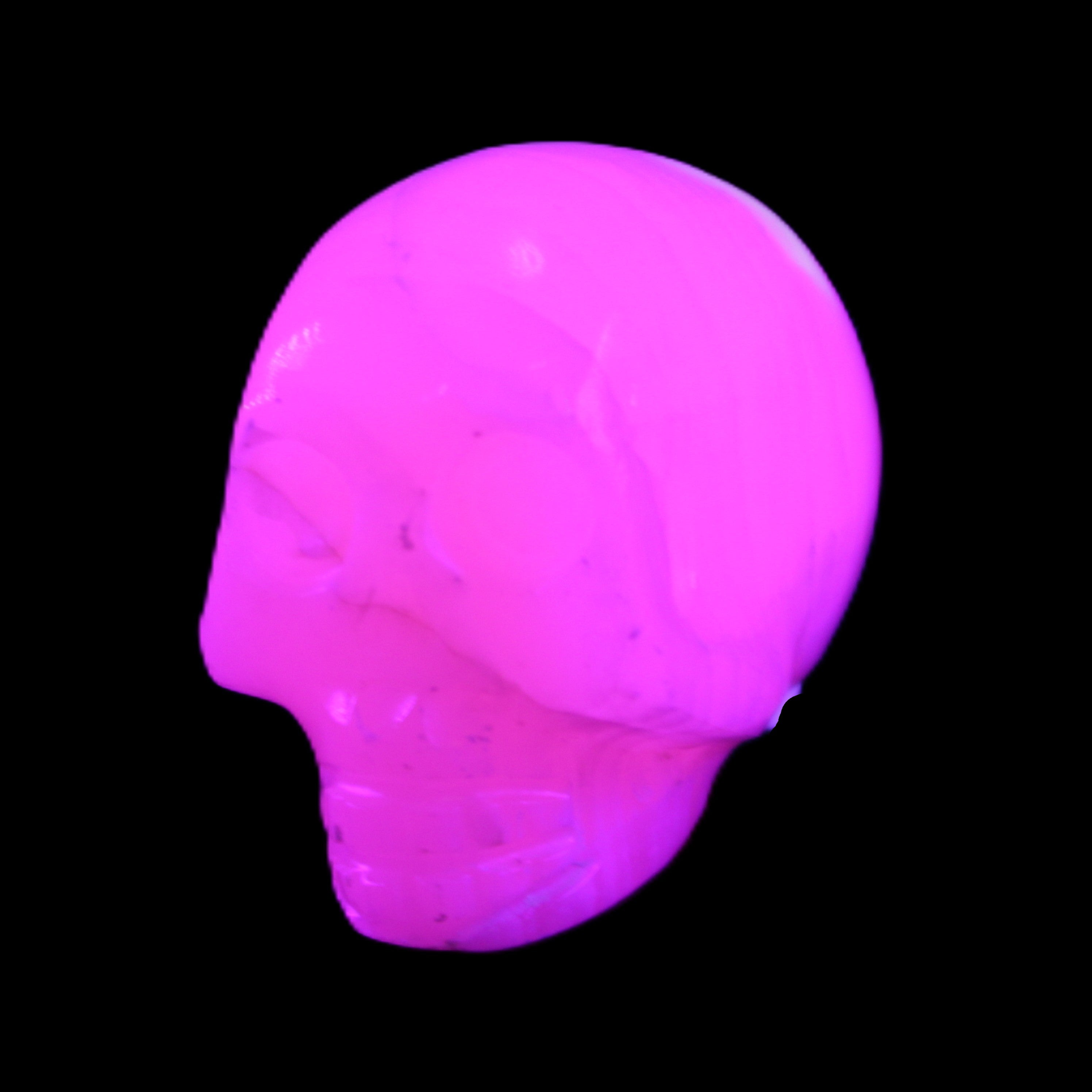 Mangano Calcite skull 31*47*40mm 87g in UV light - Rocks and Things Store
