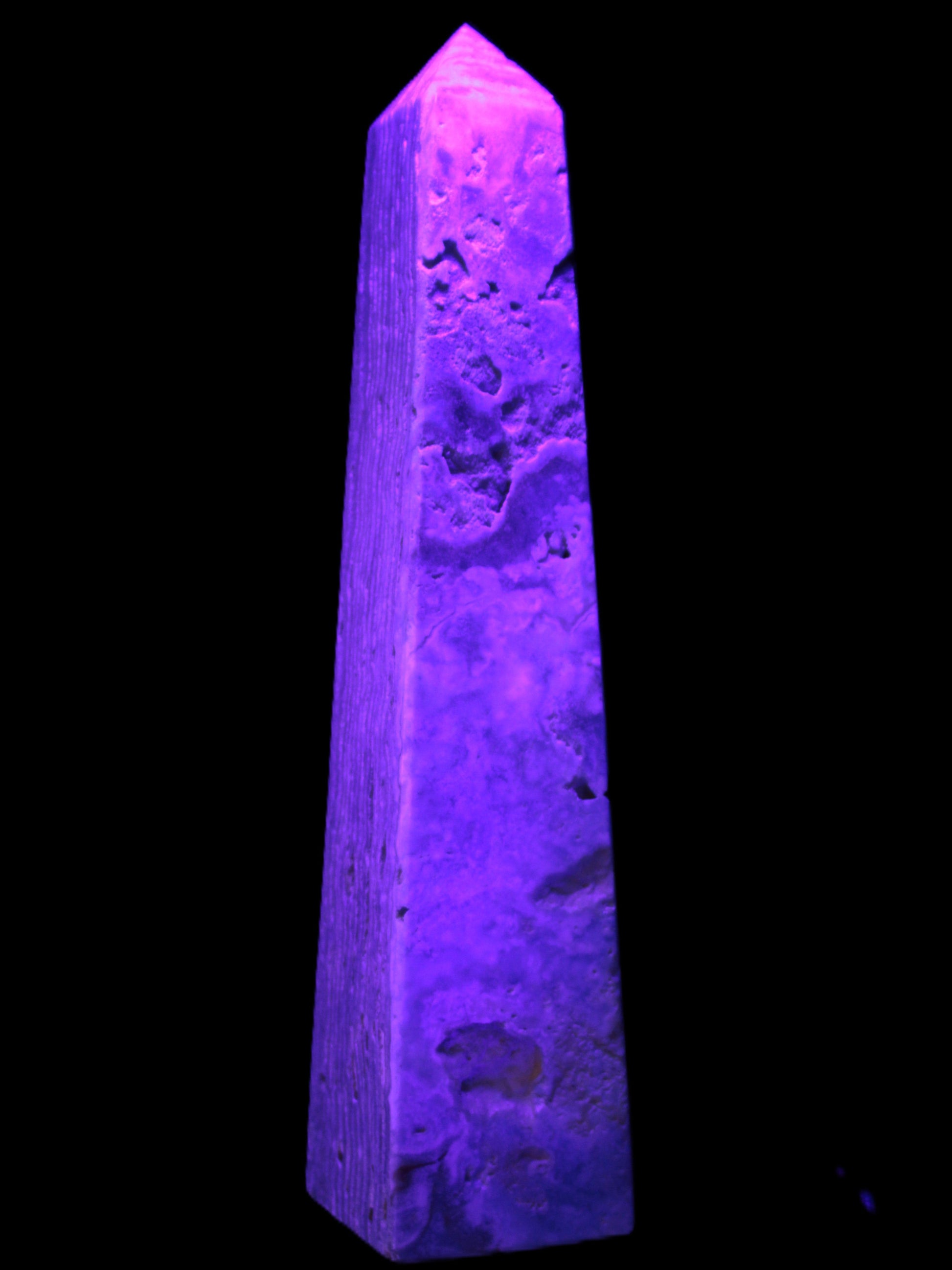 Caribbean Calcite obelisk 263*54*56mm 1271g in UV light - Rocks and Things Store