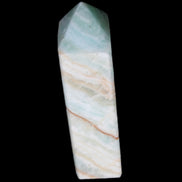 Pistachio Calcite obelisk 120mm 300g in sunlight - Rocks and Things Store